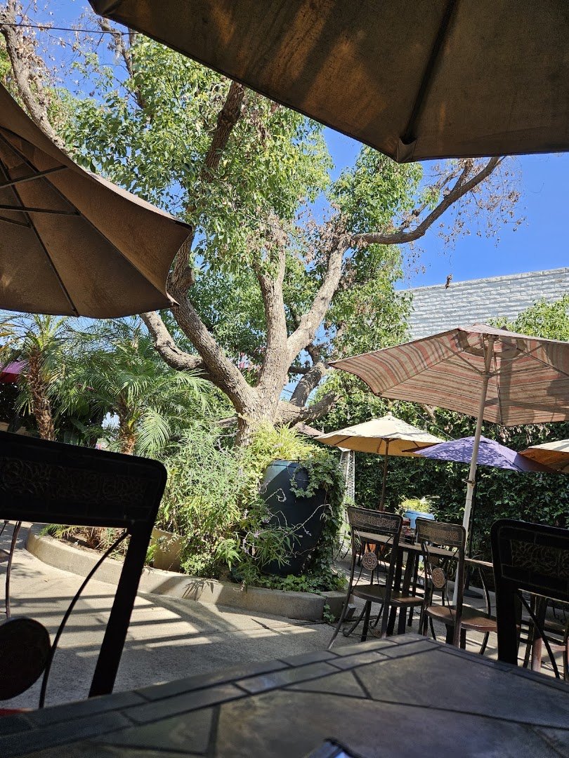Bright patio seating with casual restaurant tables.