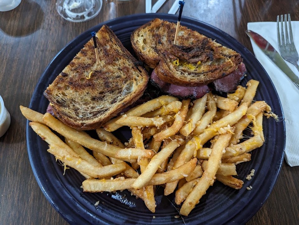 Pastrami Rueben Sandwich with Garlic Fries