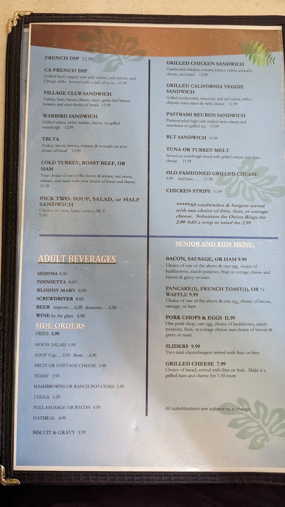 Printed menu showing waffles, sandwiches, and sides.